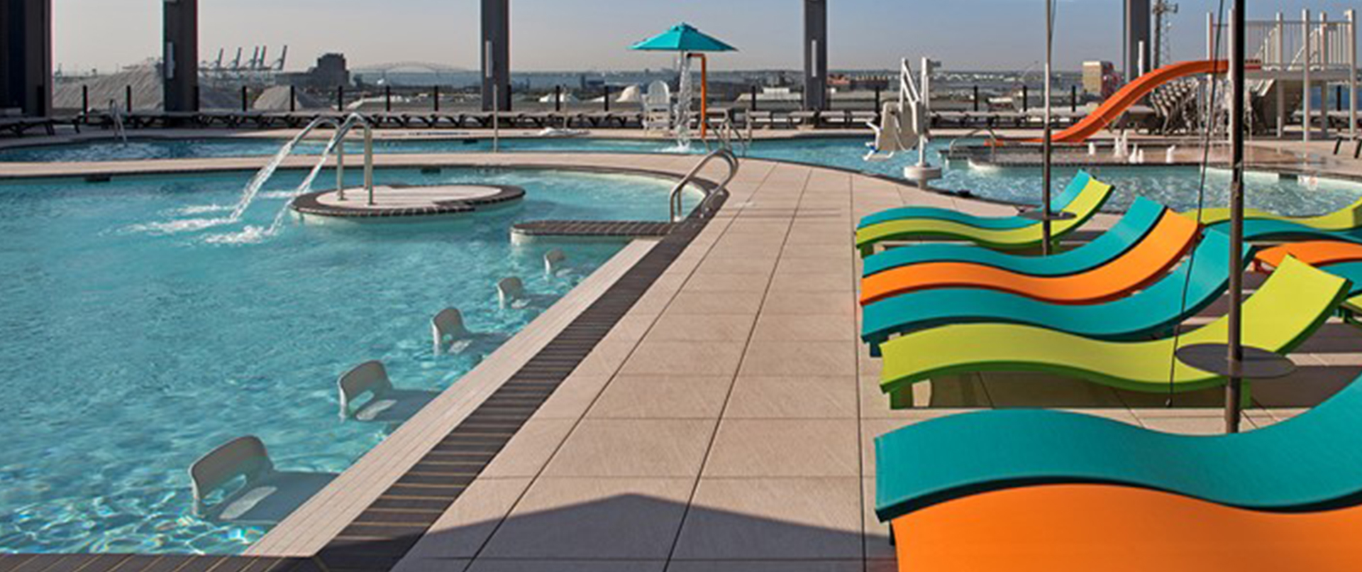 rooftop deck with pool and colorful furniture